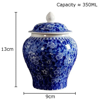 Blue and white white porcelain tea canister with floral mosaic pattern and matching lid for kitchen storage