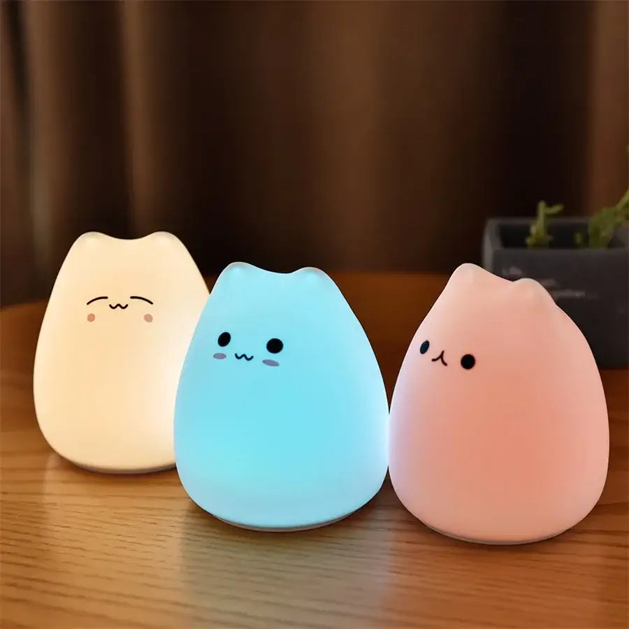 Three soft glowing cat silicone touch night lights in cream blue and pink decorbites night light for bedroom decor