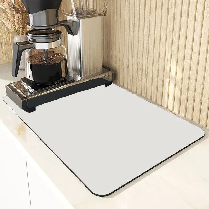 A sleek gray dining table mat with black border from decorbites dining table mat set under a coffee maker