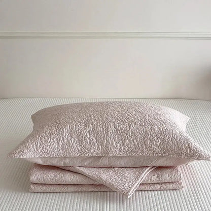 A blush pink cotton quilted bedspread set with a delicate leaf pattern for elegant bedroom decorbites cotton quilted use