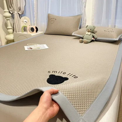 Beige textured cooling mattress pad with gray border and black bear design in blush pink diamond jacquard cooling bed sheet set