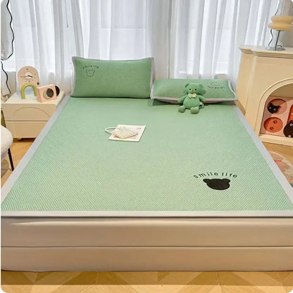 Mint green textured cooling mattress pad with black bear and smile life embroidery in blush pink cooling bed sheet set