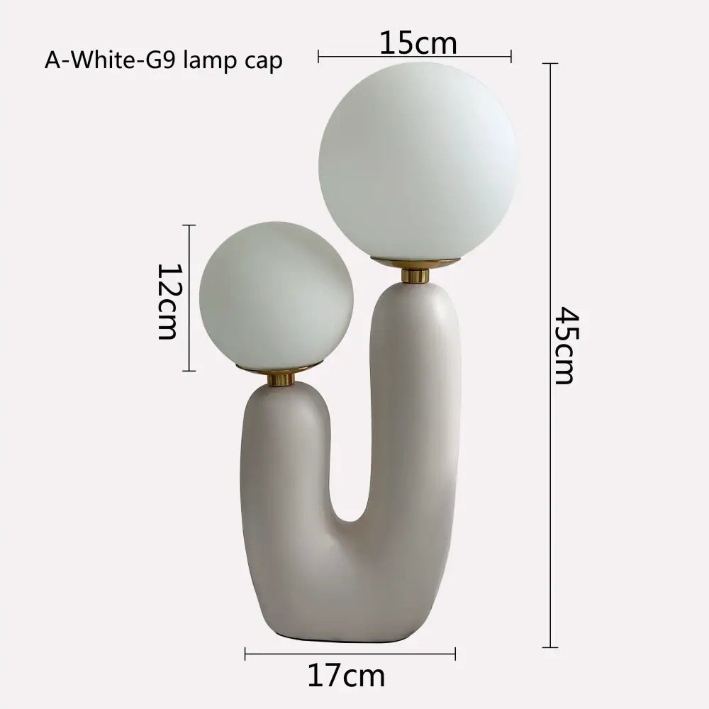 Modern minimalist blush pink and white glass ball led table lamp with frosted glass shades on matte gray ceramic base for bedroom decorbites glass ball