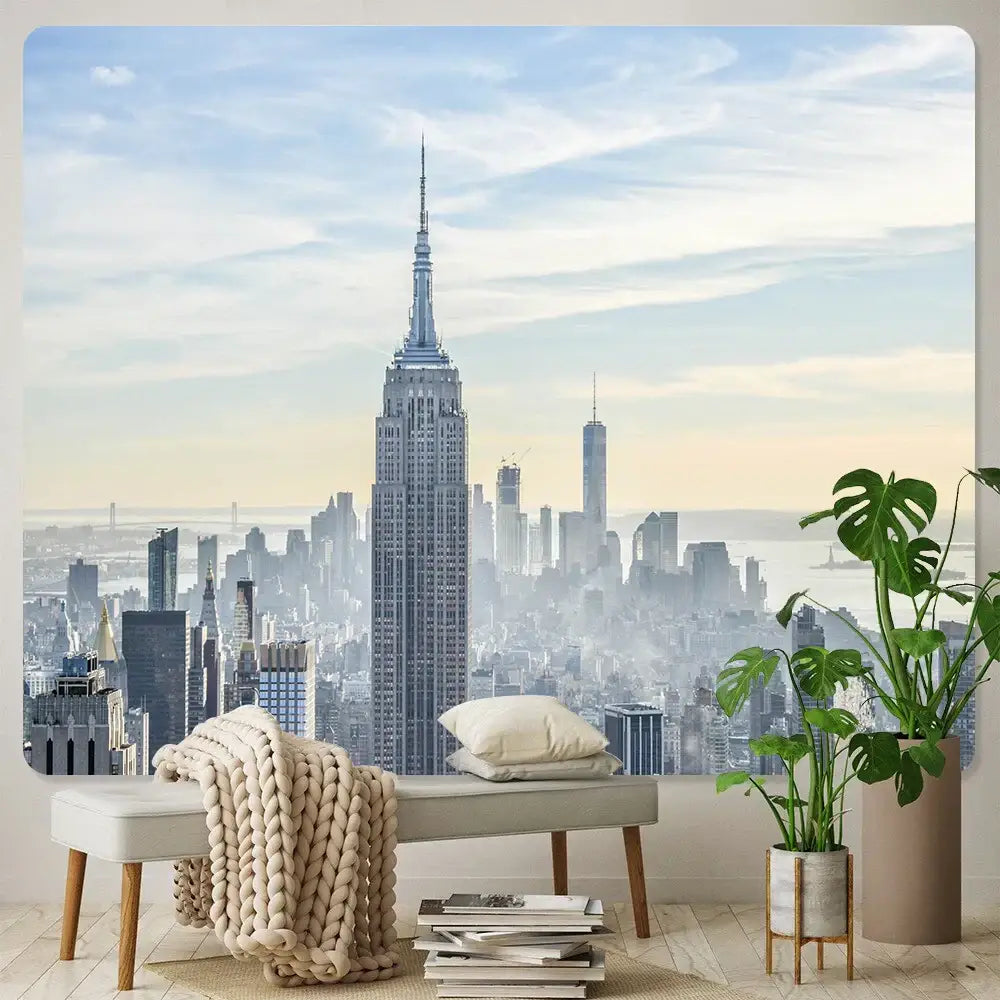 A beige knit throw blanket draped over a light gray bench with wooden legs decorbites bohemian art tapestry