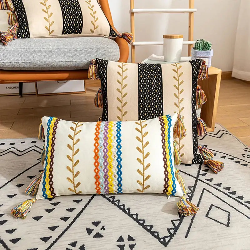 Cream-colored rectangular cotton cushion cover with bohemian cotton embroidery and colorful tassels for living room decorbites