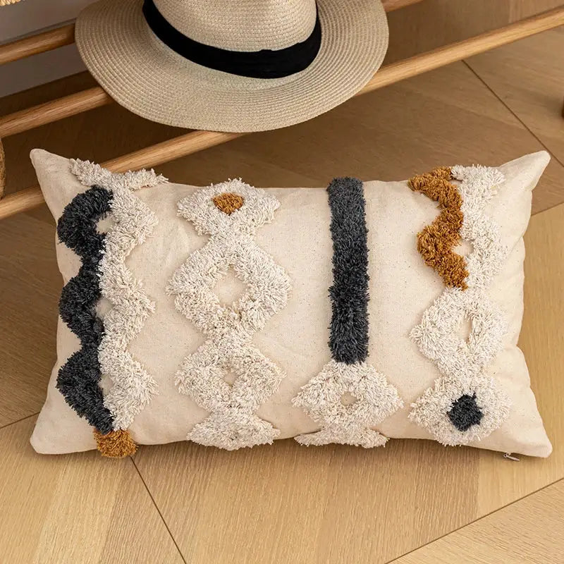 Beige rectangular bohemian beige cushion cover with chunky yarn appliqués in cream dark gray and mustard yellow decorbites