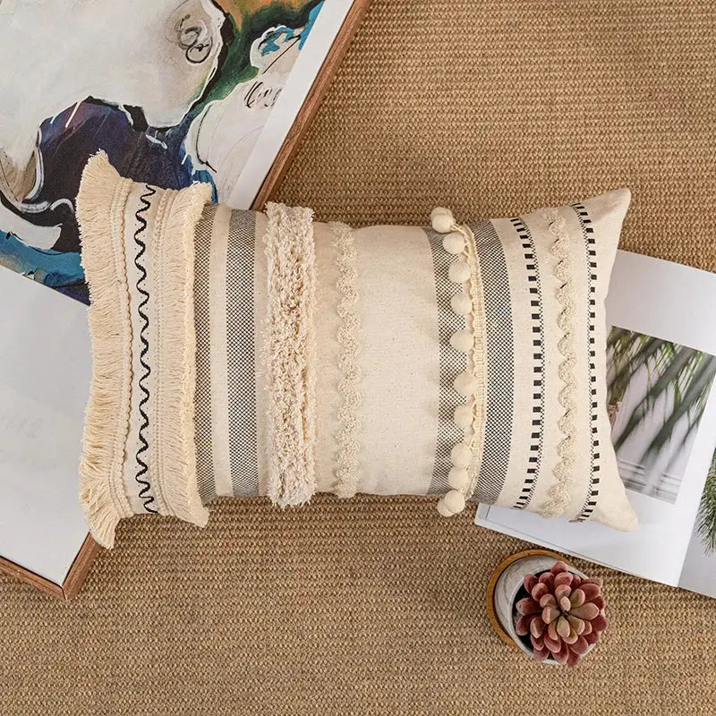 Beige and gray striped bohemian beige cushion cover with fringed edges tassels and pom-pom accents for living room decor