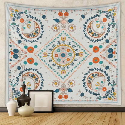 A vibrant patterned decorative tapestry yoga mat with intricate floral and mandala designs in orange teal and blue