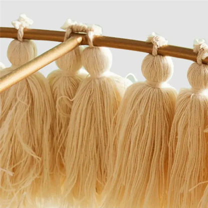 Beige cotton tassels with knotted tops hanging from wooden rod in decorbites bohemian chandelier tassel light suspension light