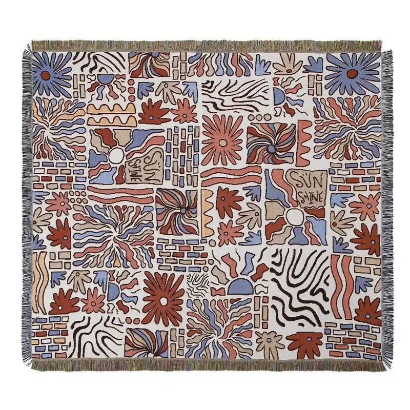 A decorbites bohemian camping blanket with vibrant floral and geometric rust blue beige patterns on off-white background