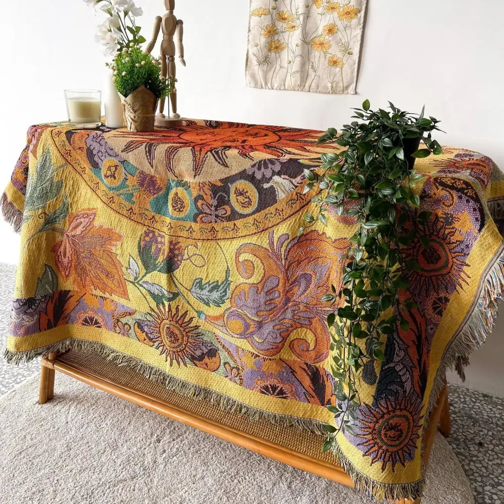 Vibrant yellow decorbites bohemian camping blanket with intricate sun motifs and fringed edges for living room decor