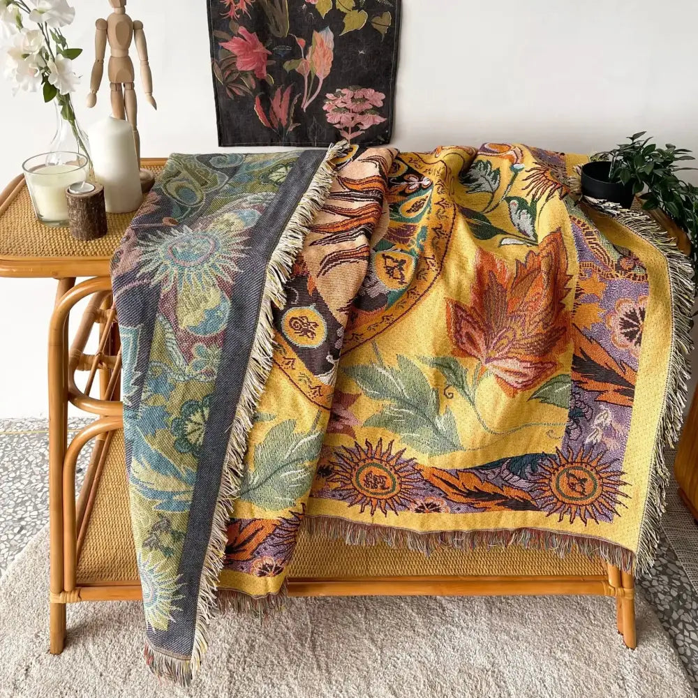 A decorbites bohemian camping blanket with a vibrant yellow sun pattern and fringed edges for living room decor