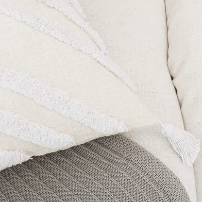 Cream-colored decorbites bohemian chenille pillowcase with textured white fringe stripes and tassel accent for living room