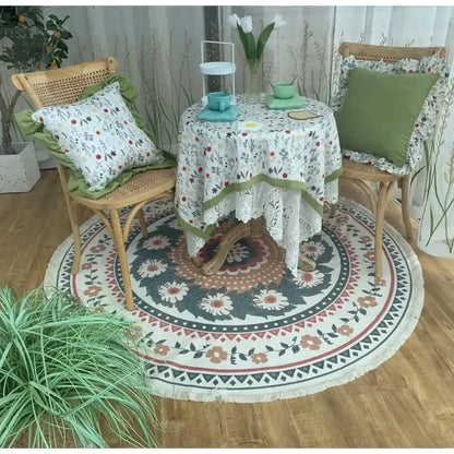 Bohemian ethnic round floral-patterned rug with white fringe and concentric green red and beige flowers for decorbites ethnic round area