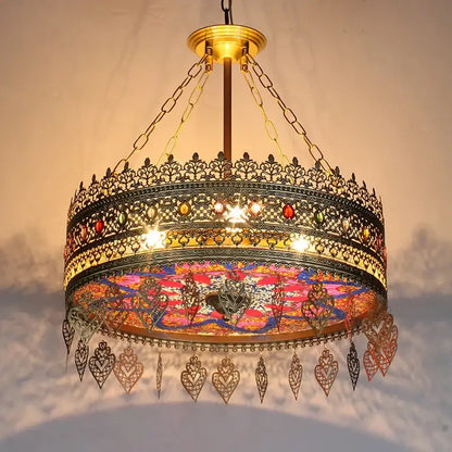 Ornate brass pendant lights with intricate filigree and colorful mosaic glass panels by decorbites bohemian exotic for dining rooms
