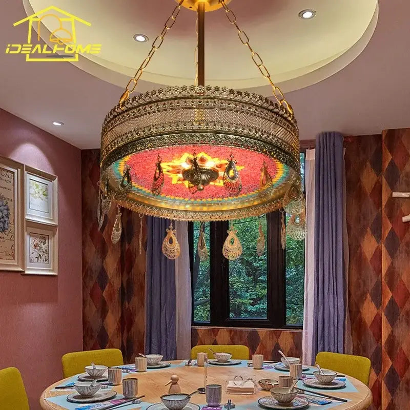 Gold-toned bohemian exotic stained pendant lights with intricate metalwork and red mosaic glass for dining room decorbites