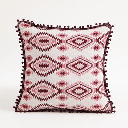 Bohemian flower cushion cover with white base, pink geometric patterns, and dark red pom-pom trim for living room decorbites bohemian flower cushion