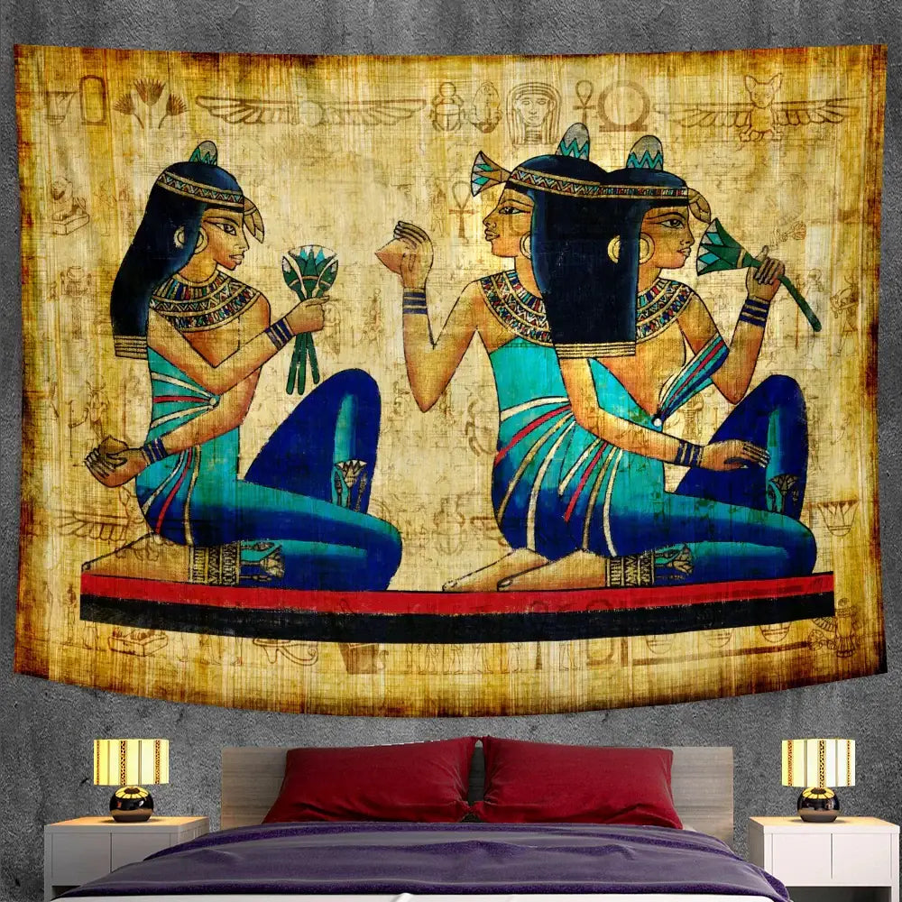 Bohemian gold and red egyptian mural tapestry featuring two women in turquoise blue attire with hieroglyphic patterns