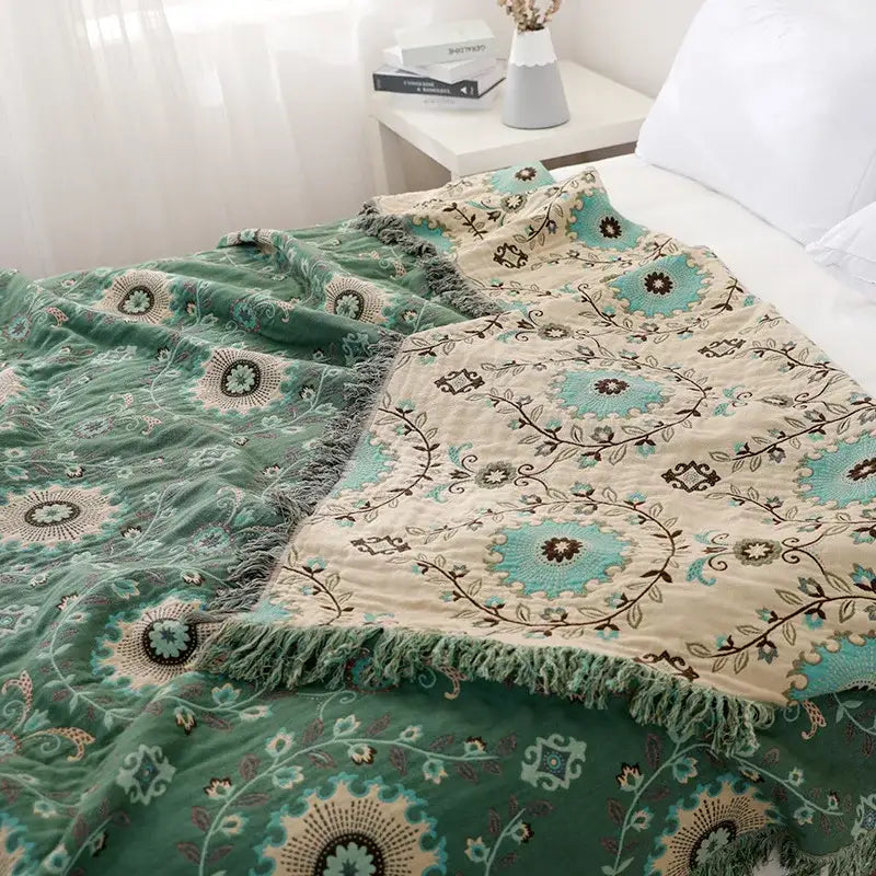 Bohemian cotton sofa throw blanket in green and cream with teal and brown floral embroidery from decorbites