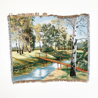 Bohemian jacquard sofa blanket with woven pastoral autumn forest scene featuring birch trees and a wooden bridge