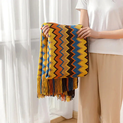Vibrant multicolored bohemian knit tassel blanket with zigzag pattern in yellow orange blue and brown for bedroom decorbites bohemian knit