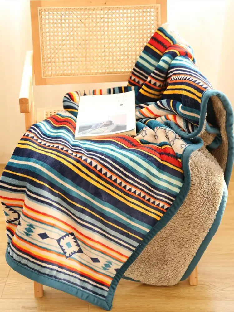 Cozy bohemian multicolored striped coral fleece sofa blanket with geometric patterns and plush sherpa lining for winter use