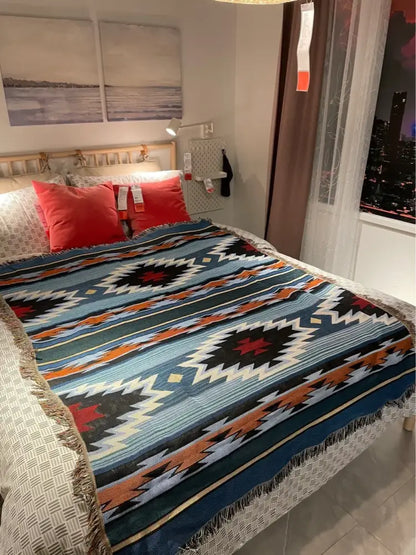 Bohemian nordic leisure throw woven blanket with blue black and orange geometric pattern and fringed edges for decorbites