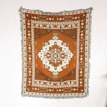 Decorbites bohemian outdoor blanket woven with rust orange and cream geometric pattern and fringed edges for living room decor