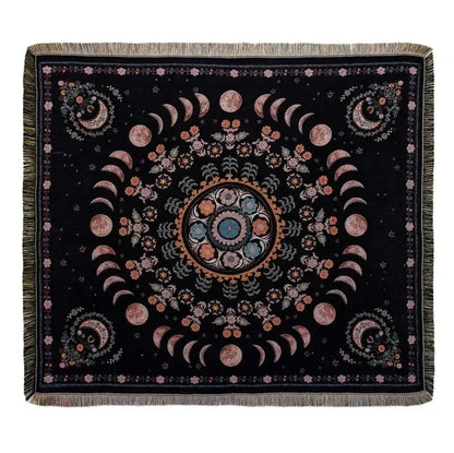 Black throw blanket with moon phase and floral patterns in pinks blues and golds with fringed edges from decorbites bohemian outdoor blanket collection