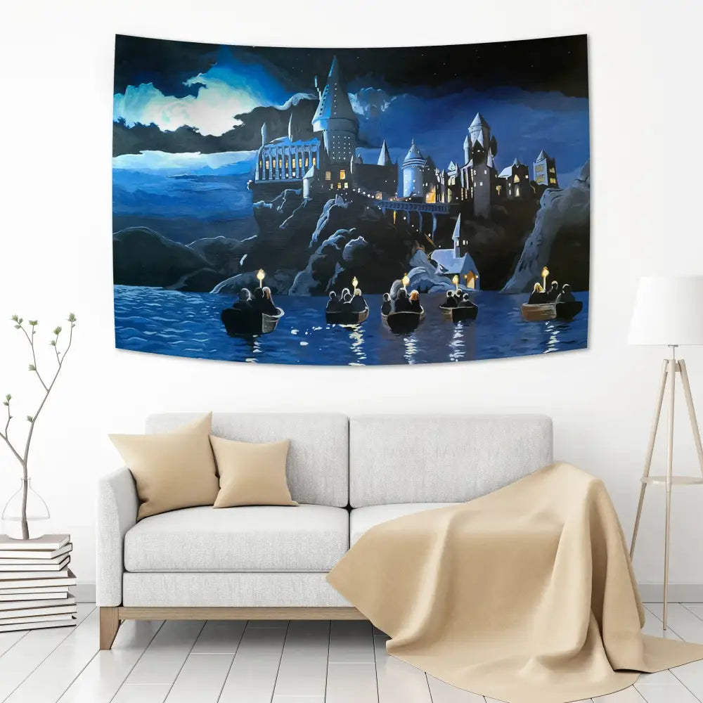 Dark blue and black hogwarts art tapestry depicting the castle illuminated at night with boats on water for wall decor