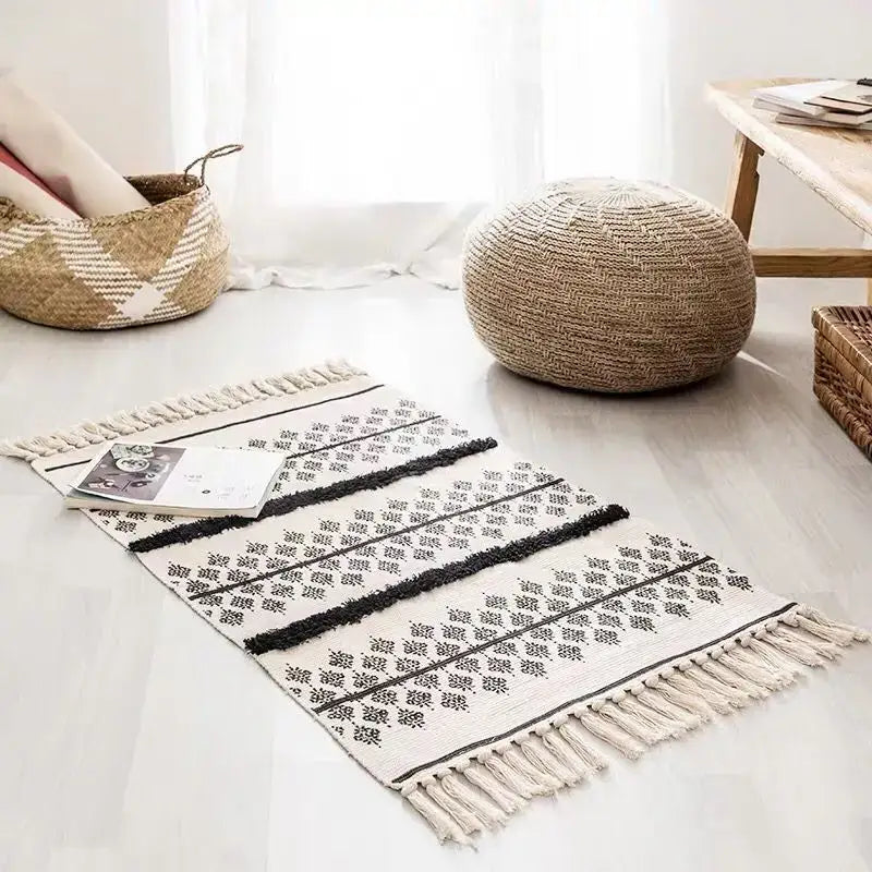 Cream-colored decorbites bohemian tassel rug with black geometric patterns and tassels for living room decor