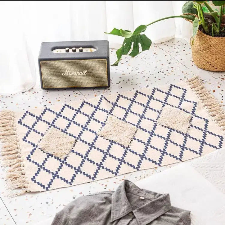 Beige and navy blue decorbites bohemian tassel rug with geometric textured squares and fringed edges for living room decor