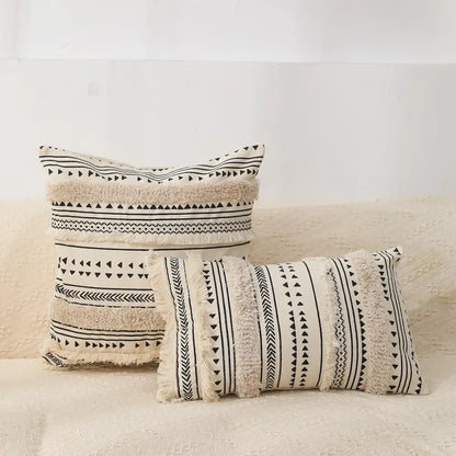 Cream-colored bohemian tufted tassel pillow case with black geometric patterns and fringed edges for living room decorbites decor