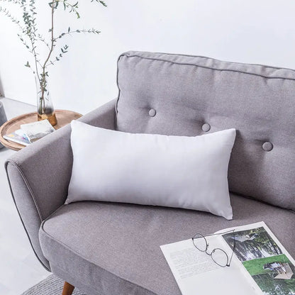 White rectangular bohemian tufted tassel pillow case beige geometric cushion on gray sofa by decorbites