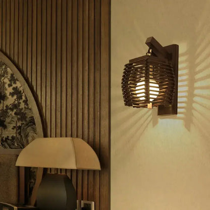 Dark wooden bamboo wall sconce light with woven lattice design casting warm slanted light for corridor use