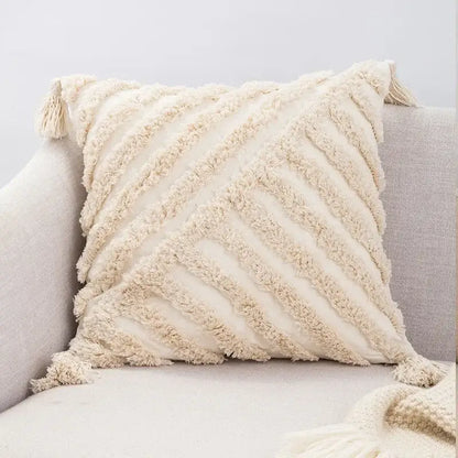 Cream-colored woven boho cushion cover with textured fringed diagonal stripes and tassels for decorbites beige boho style