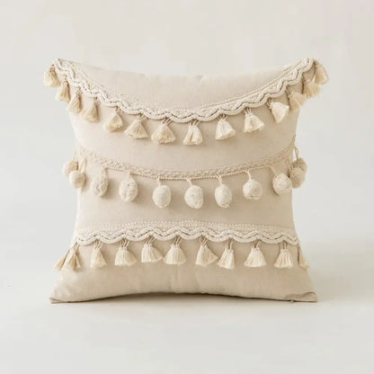 Beige cushion cover with three horizontal rows of tufted fringed tassels and pom-poms decorbites beige tufted design