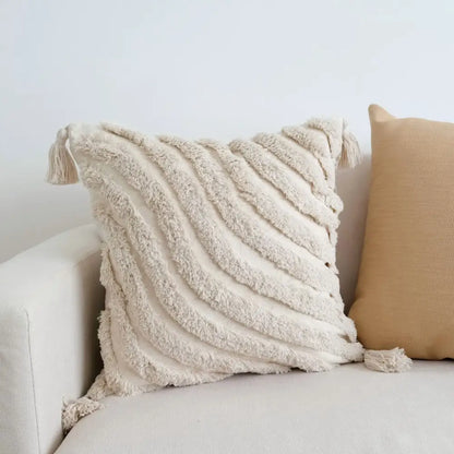 Cream-colored boho beige white pillow cases with textured fabric and woven tassels for living room decorbites boho beige decor