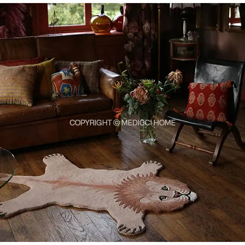 A plush beige and tan lion-shaped rug with textured fur on wooden floor contrasting decorbites boho black bear rug