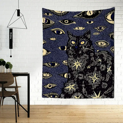 A dark blue boho cat eyes tapestry featuring a black cat with glowing yellow eyes and celestial gold decorbites motifs