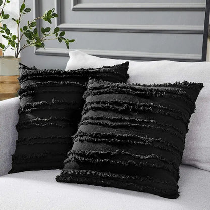 Boho black tassel striped pillow covers featuring textured fabric and frayed horizontal stripes for home decor
