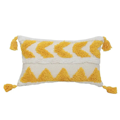 Cream-colored boho chenille tufted pillow case with mustard-yellow chevron patterns and tassels for living room decorbites decor