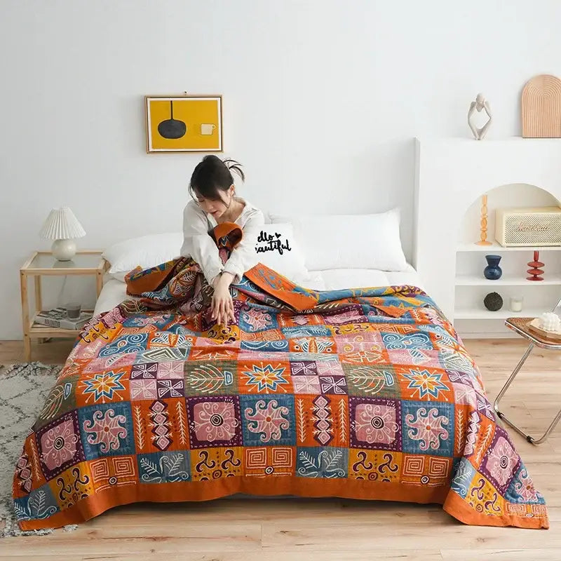 Vibrant decorbites boho cotton blanket with bold orange blue and pink geometric patchwork perfect for bedroom decor