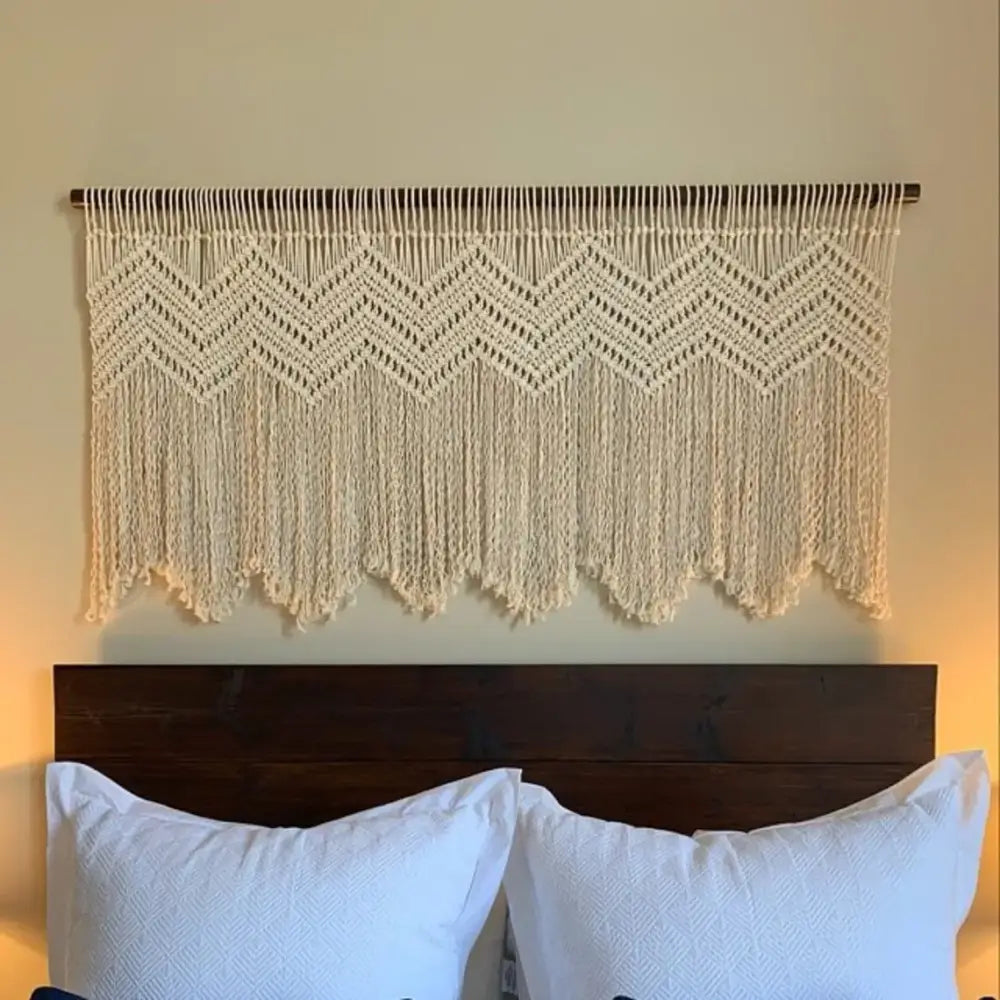 Cream-colored boho cotton wove macrame wall hanging with zigzag pattern and fringe for decorbites bedroom decor