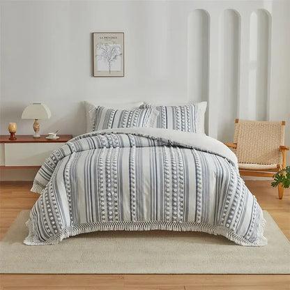 Gray and white striped quilted duvet set with textured pom-pom detailing from decorbites boho stripe furball collection