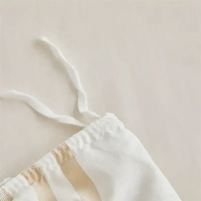 White drawstring waistband with beige fabric stripes and elastic gathering on boho stripe furball duvet set by decorbites
