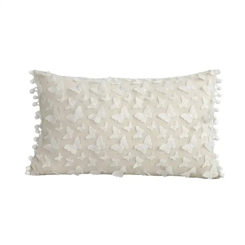 Cream cushion cover with lace floral butterfly appliqués and pom-pom trim for decorbites boho white style living room decor