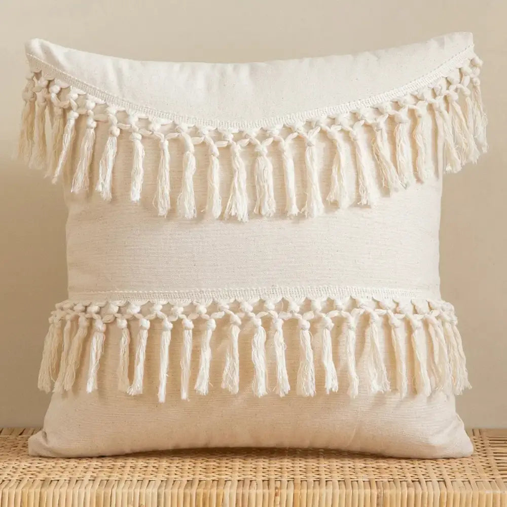 Cream-colored lace floral cushion cover with two rows of hand-knotted tassels for decorbites boho white style decor
