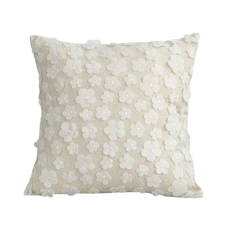Off-white square cushion cover with delicate lace floral appliqués for boho decorbites boho white living room design