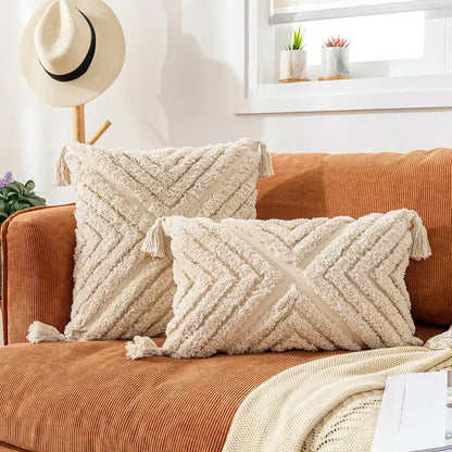 Cream-colored textured cotton pillow cover with woven chevron pattern and boho cotton tassel decorbites boho cotton tassel decor